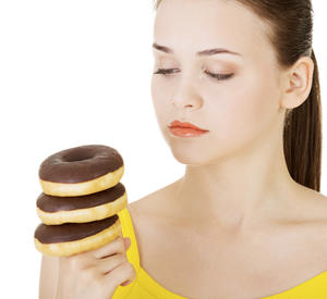 Thinkstock woman with donuts